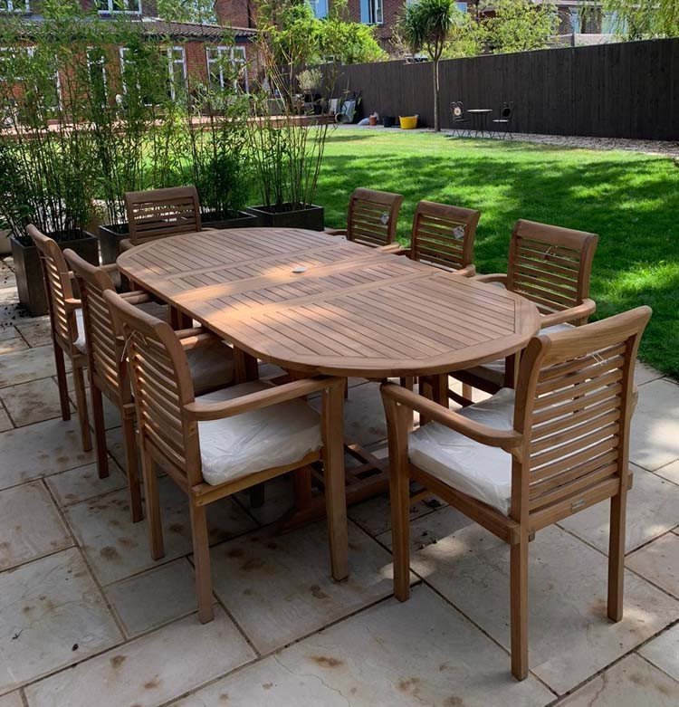 This teak garden dining set is amazing value - double extending table 1.8m to 2.4m, 8 x teak stacking chairs, free 3m parasol and cushions