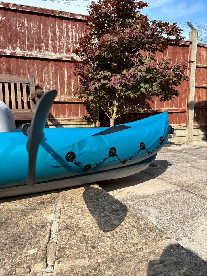 Inflatable double kayak with paddles